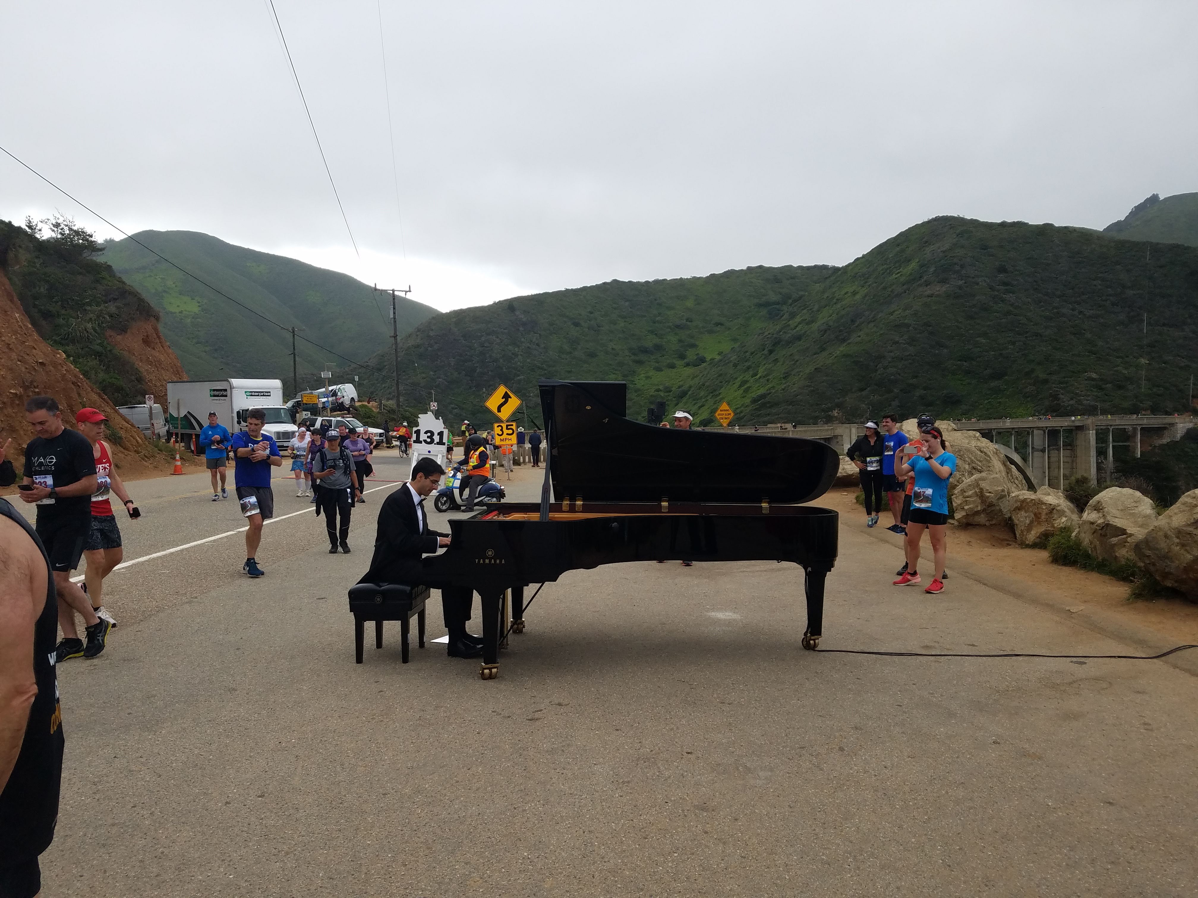 Photo of pianist at Bixby Creek Bridge during the Big Sur Marathon